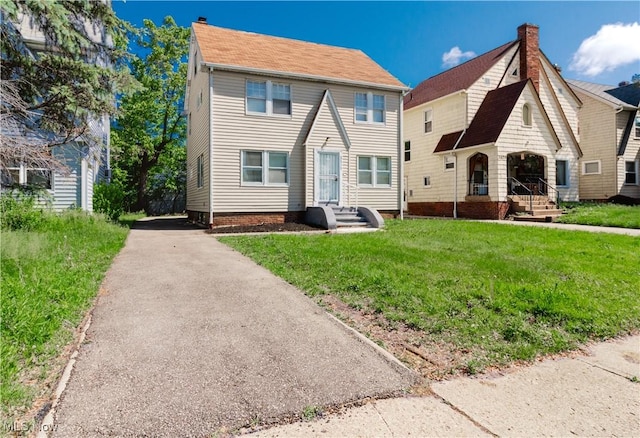 3525 Raymont Rd, University Heights, OH 44118 - view of front of property with a front lawn