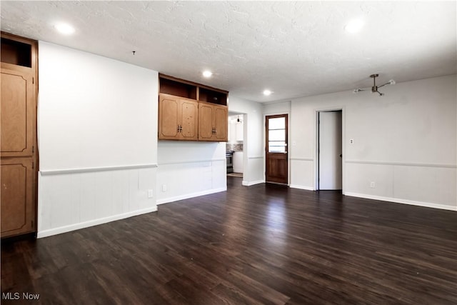3525 Raymont Rd, University Heights, OH 44118 - unfurnished living room with dark wood-style floors, recessed lighting, baseboards, and a textured ceiling