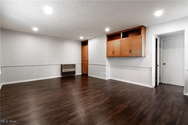 3525 Raymont Rd, University Heights, OH 44118 - unfurnished living room featuring recessed lighting, dark wood-type flooring, radiator, and baseboards