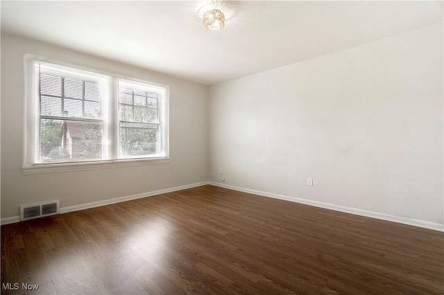 3525 Raymont Rd, University Heights, OH 44118 - spare room featuring dark wood-type flooring and baseboards