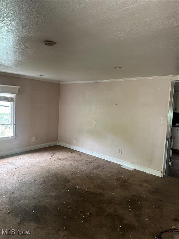 231 Pine St, Weirton, WV 26062 - unfurnished room featuring a textured ceiling, crown molding, and baseboards