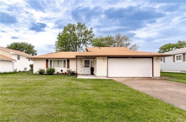 1922 W 38th St, Lorain, OH 44053 - ranch-style house with a garage, driveway, and a front lawn