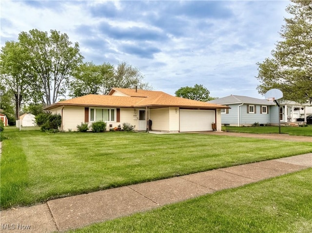 1922 W 38th St, Lorain, OH 44053 - ranch-style home featuring an attached garage, a front lawn, and driveway