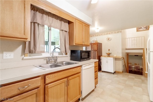 1922 W 38th St, Lorain, OH 44053 - kitchen with dishwasher, black microwave, light floors, a sink, and light countertops