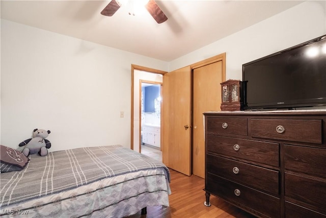 1922 W 38th St, Lorain, OH 44053 - bedroom featuring light wood finished floors, a closet, and a ceiling fan