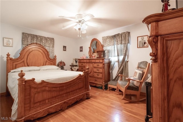 1922 W 38th St, Lorain, OH 44053 - bedroom with light wood-type flooring and ceiling fan