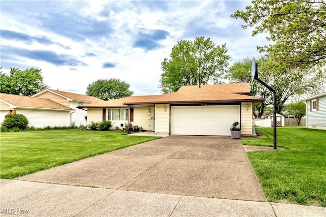 1922 W 38th St, Lorain, OH 44053 - ranch-style home featuring an attached garage, a front lawn, and concrete driveway