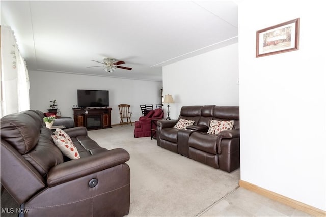 1922 W 38th St, Lorain, OH 44053 - living room featuring ceiling fan, baseboards, and light colored carpet