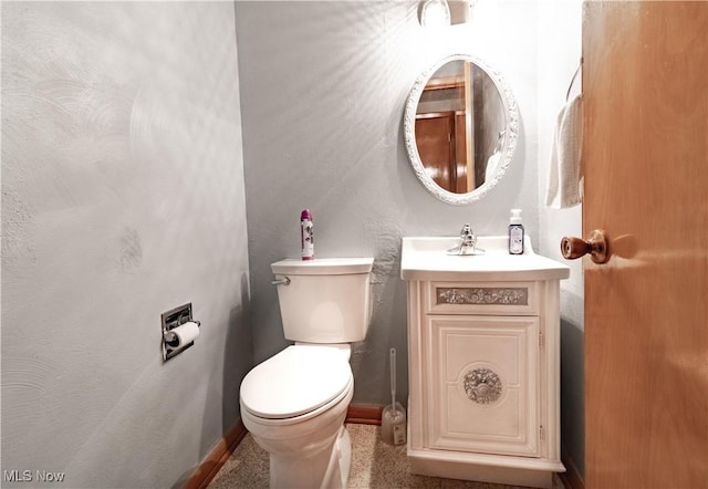 1922 W 38th St, Lorain, OH 44053 - half bathroom featuring baseboards, toilet, and vanity