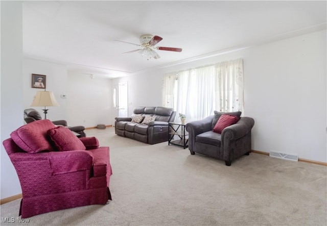 1922 W 38th St, Lorain, OH 44053 - living area featuring carpet flooring, a ceiling fan, and baseboards
