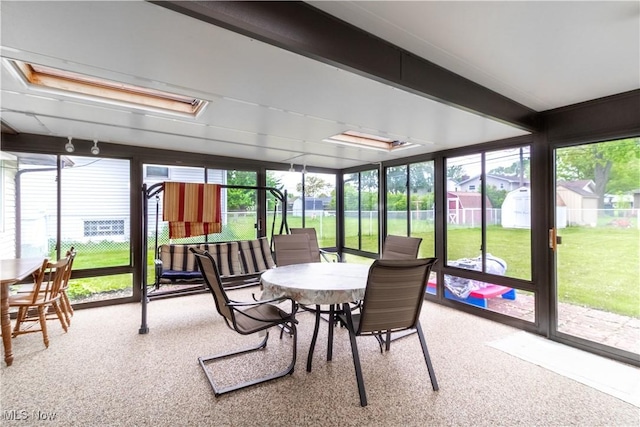1922 W 38th St, Lorain, OH 44053 - sunroom with outdoor dining space and carpet