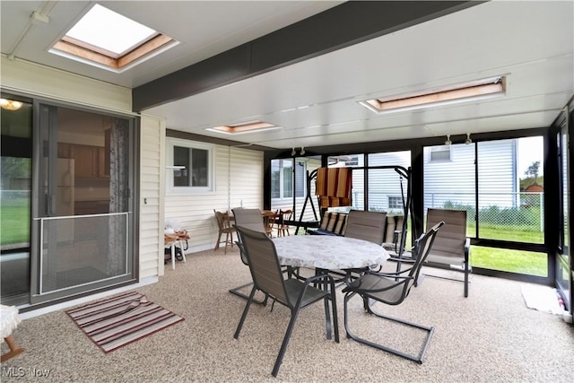 1922 W 38th St, Lorain, OH 44053 - sunroom / solarium featuring outdoor dining space, a skylight, and carpet flooring