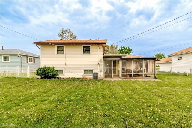 1922 W 38th St, Lorain, OH 44053 - rear view of property featuring a sunroom and central air condition unit