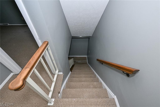 625 Canterbury Ln, Medina, OH 44256 - stairs with carpet floors, baseboards, and a textured ceiling
