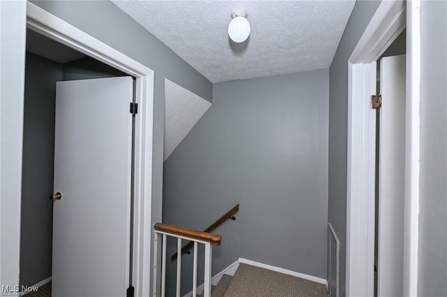 625 Canterbury Ln, Medina, OH 44256 - staircase with a textured ceiling, carpet flooring, and baseboards