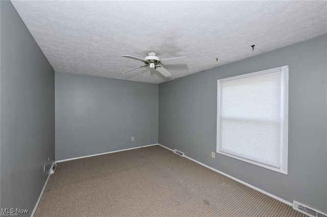 625 Canterbury Ln, Medina, OH 44256 - carpeted empty room with a ceiling fan, baseboards, and a textured ceiling