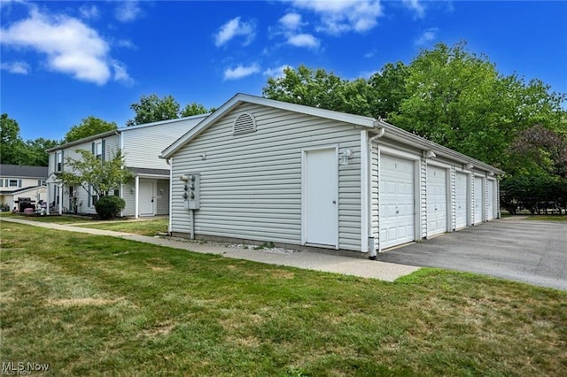625 Canterbury Ln, Medina, OH 44256 - view of side of home with community garages and a yard
