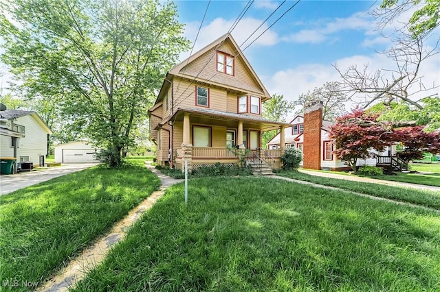 5100 Greenhurst Dr, Maple Heights, OH 44137 - traditional style home featuring a porch, an outbuilding, a front lawn, and a garage