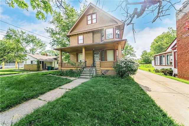 5100 Greenhurst Dr, Maple Heights, OH 44137 - traditional style home with a porch, a front yard, and concrete driveway