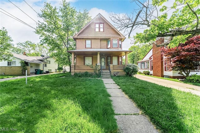 5100 Greenhurst Dr, Maple Heights, OH 44137 - view of front of house featuring covered porch and a front lawn