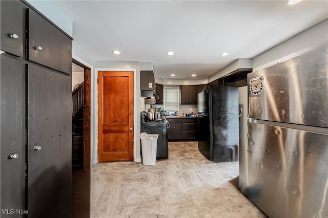 5100 Greenhurst Dr, Maple Heights, OH 44137 - kitchen featuring freestanding refrigerator, stove, recessed lighting, and wall chimney range hood