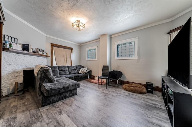 5100 Greenhurst Dr, Maple Heights, OH 44137 - living room with wood-type flooring, crown molding, a textured ceiling, a fireplace, and baseboards
