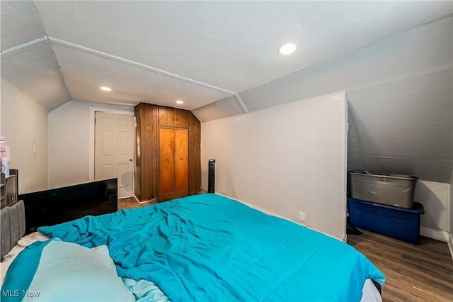5100 Greenhurst Dr, Maple Heights, OH 44137 - bedroom featuring vaulted ceiling, wood finished floors, and recessed lighting