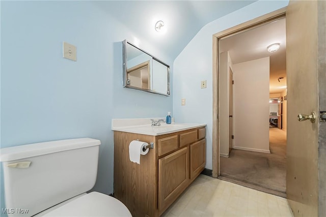 3573 Severn Rd, Cleveland Heights, OH 44118 - half bath featuring toilet, vanity, lofted ceiling, and baseboards