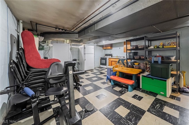 3573 Severn Rd, Cleveland Heights, OH 44118 - finished basement with tile patterned floors and freestanding refrigerator