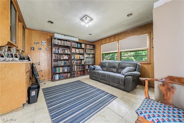 3573 Severn Rd, Cleveland Heights, OH 44118 - living area with wood walls, a textured ceiling, and light tile patterned flooring
