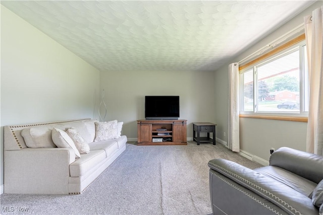 731 39th St SW, Canton, OH 44706 - carpeted living area with baseboards and a textured ceiling