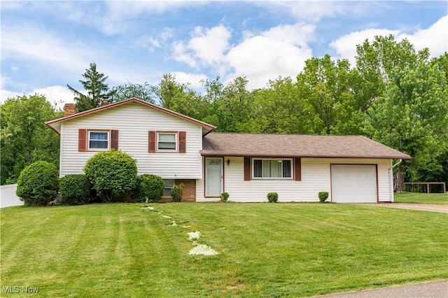 731 39th St SW, Canton, OH 44706 - split level home with an attached garage, driveway, and a chimney