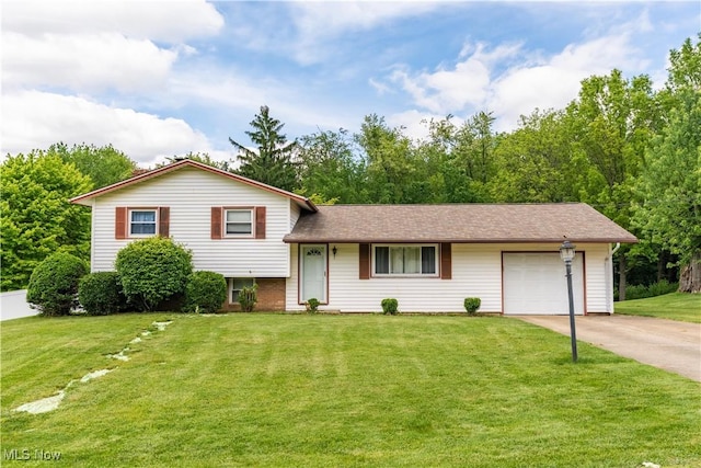 731 39th St SW, Canton, OH 44706 - split level home with a garage, concrete driveway, and a front lawn