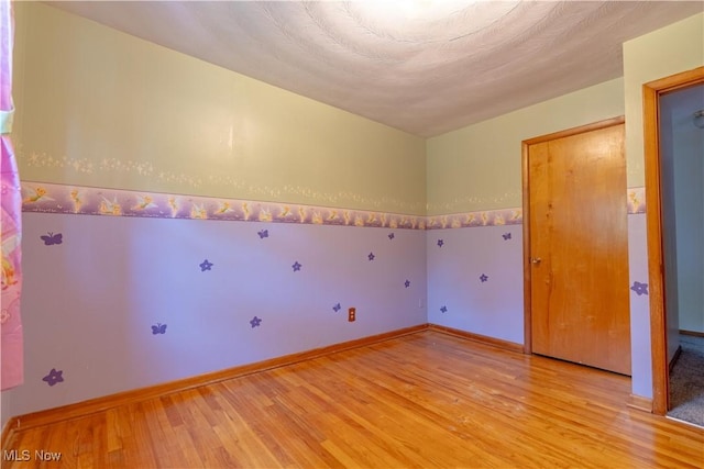 731 39th St SW, Canton, OH 44706 - empty room featuring light wood-style floors and baseboards