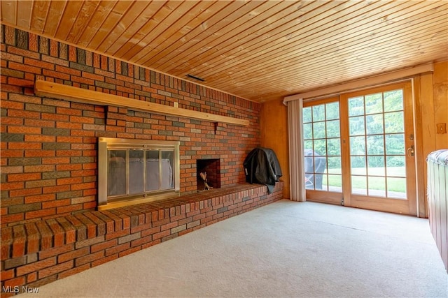 731 39th St SW, Canton, OH 44706 - unfurnished living room with wooden ceiling, a brick fireplace, carpet floors, radiator heating unit, and wood walls