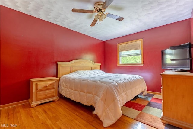 731 39th St SW, Canton, OH 44706 - bedroom featuring wood finished floors, baseboards, and ceiling fan