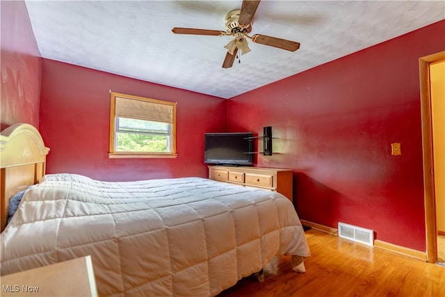 731 39th St SW, Canton, OH 44706 - bedroom featuring baseboards, wood finished floors, and ceiling fan