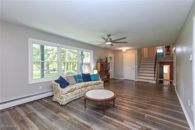 12274 Kile Rd, Chardon, OH 44024 - living room with baseboard heating, stairway, wood finished floors, and ceiling fan