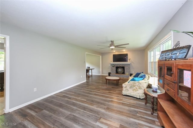 12274 Kile Rd, Chardon, OH 44024 - living area featuring ceiling fan, a brick fireplace, and wood finished floors