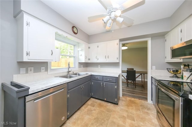12274 Kile Rd, Chardon, OH 44024 - kitchen featuring stainless steel appliances, white cabinets, and light countertops