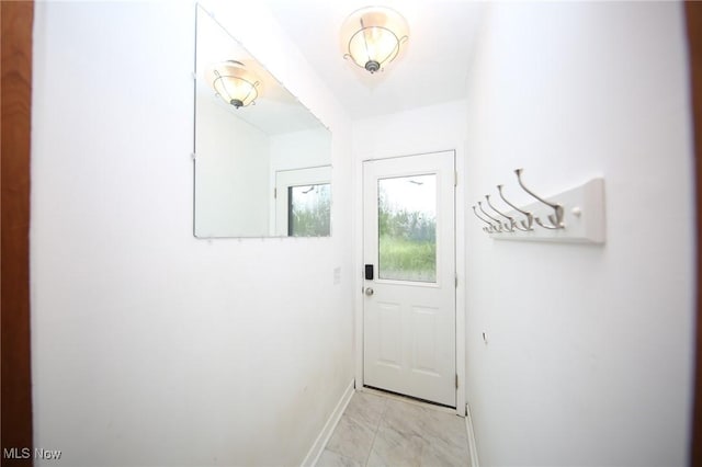 12274 Kile Rd, Chardon, OH 44024 - doorway featuring light marble finish flooring and baseboards