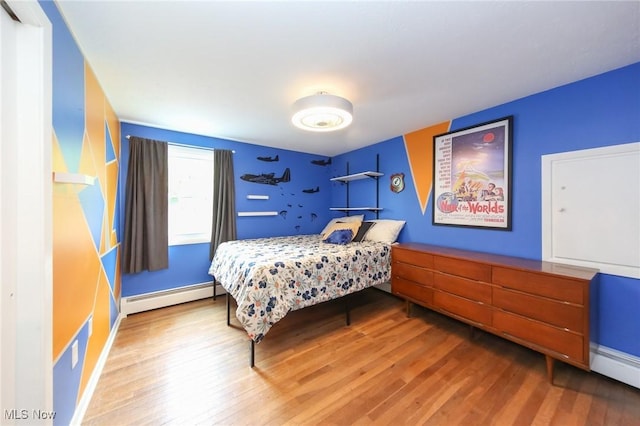 12274 Kile Rd, Chardon, OH 44024 - bedroom featuring a baseboard radiator and wood finished floors