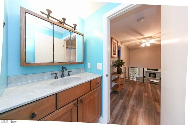 12274 Kile Rd, Chardon, OH 44024 - bathroom with vanity, wood finished floors, and ceiling fan