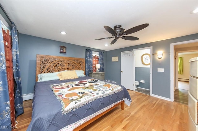 12274 Kile Rd, Chardon, OH 44024 - bedroom featuring wood finished floors, a baseboard heating unit, recessed lighting, and a ceiling fan