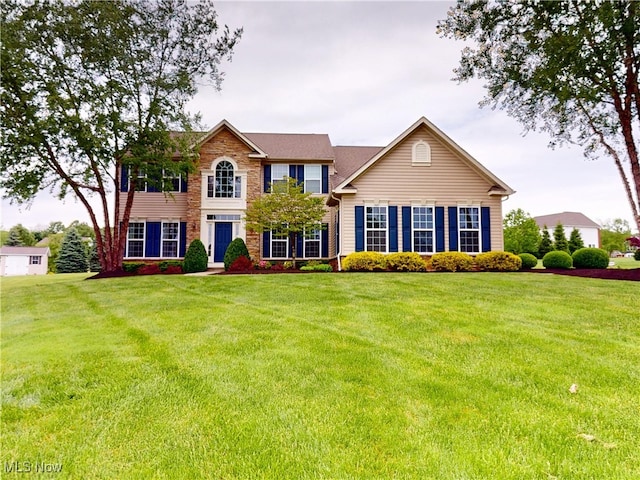 4171 Appleridge Ln, Richfield, OH 44286 - colonial-style house featuring a front yard and stone siding