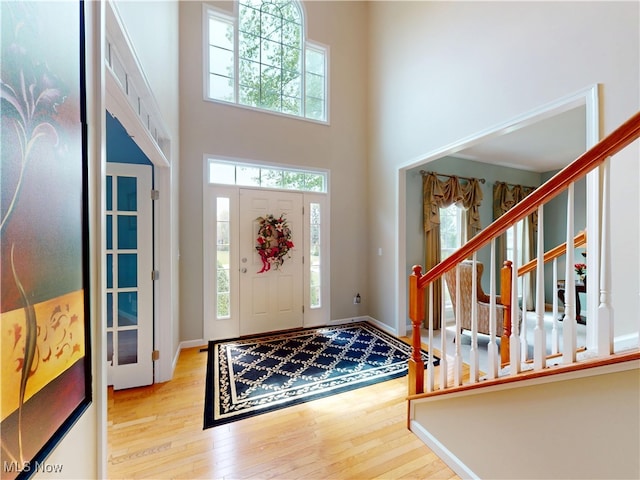 4171 Appleridge Ln, Richfield, OH 44286 - foyer featuring hardwood / wood-style floors, a towering ceiling, baseboards, and stairs