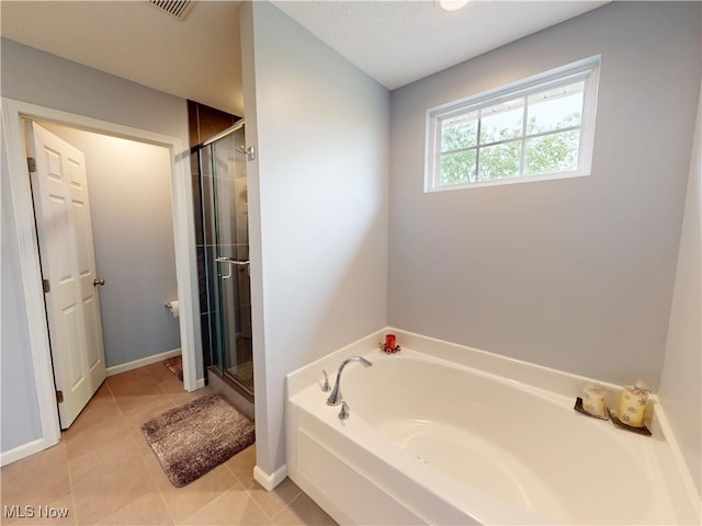 4171 Appleridge Ln, Richfield, OH 44286 - full bath with a bath, a stall shower, tile patterned floors, and baseboards