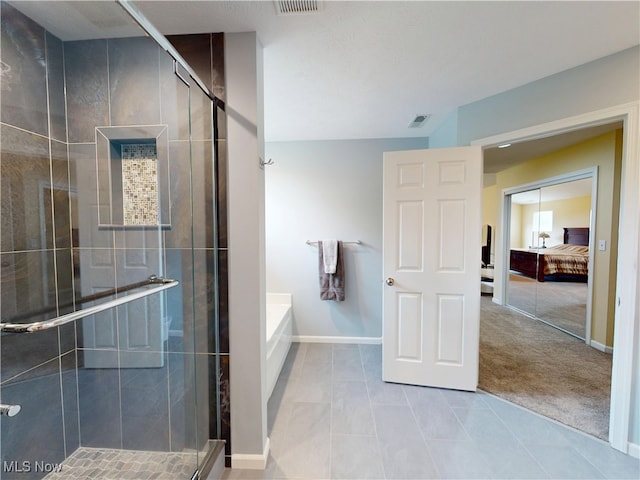4171 Appleridge Ln, Richfield, OH 44286 - full bathroom with a stall shower, ensuite bath, baseboards, a garden tub, and tile patterned flooring
