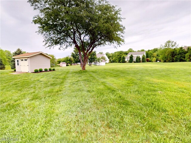 4171 Appleridge Ln, Richfield, OH 44286 - view of grassy yard with an outdoor structure and a garage