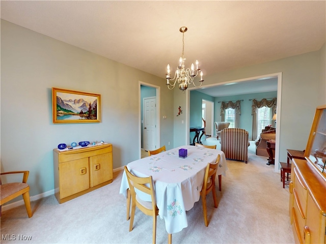 4171 Appleridge Ln, Richfield, OH 44286 - dining room featuring a chandelier, light colored carpet, and baseboards